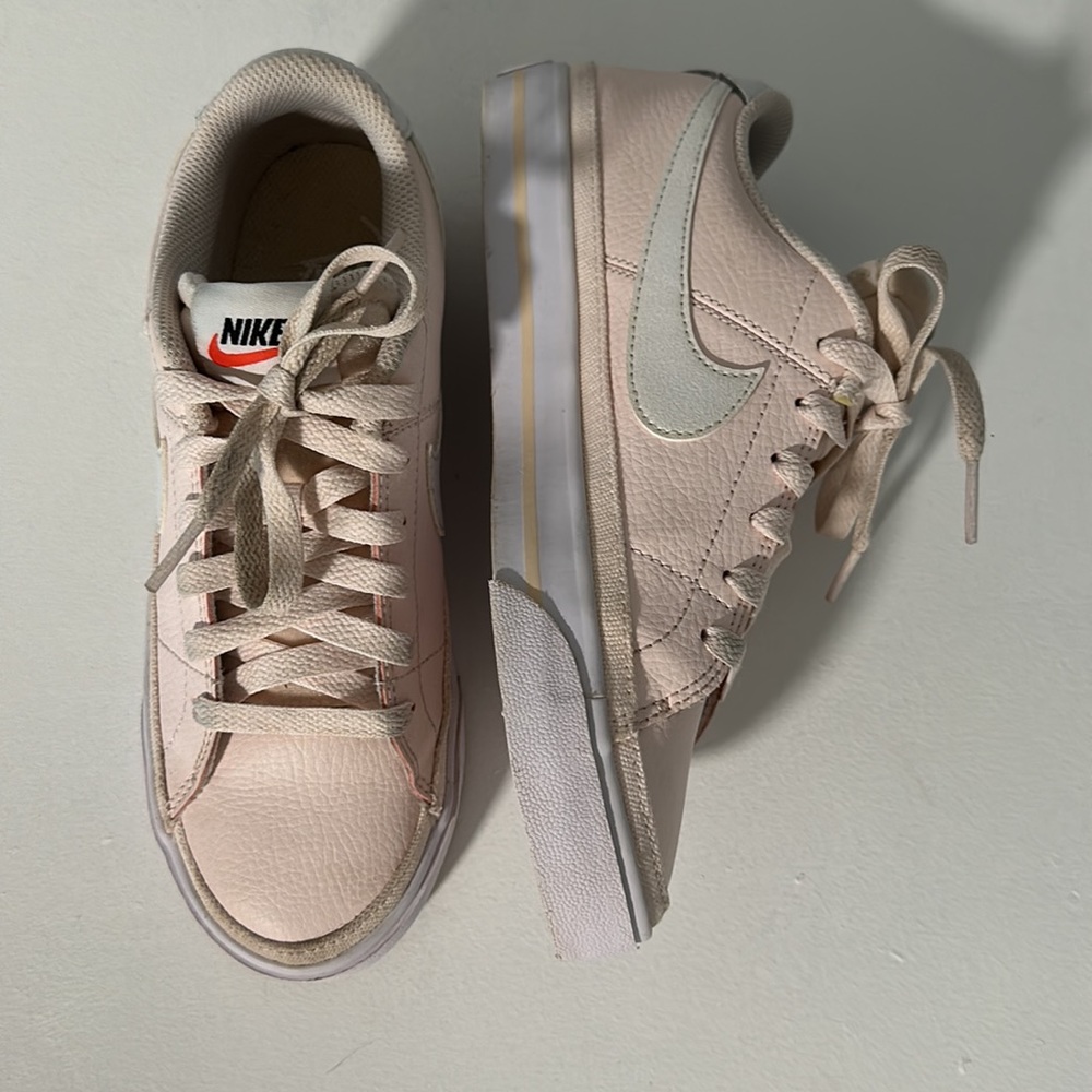 NIKE pink and white shoes, size 6 in women’s.